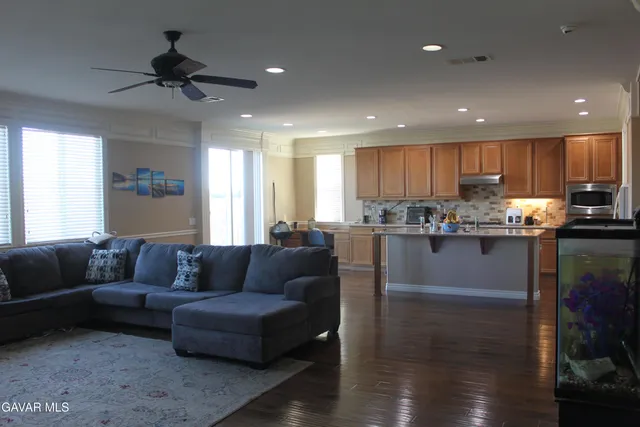 a view of a bedroom with furniture and a window