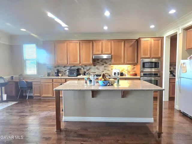 a work room with furniture and a rug
