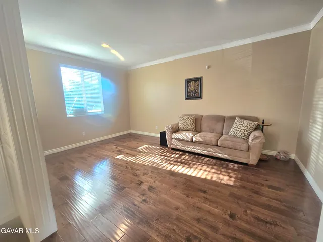 a kitchen with granite countertop cabinets and window