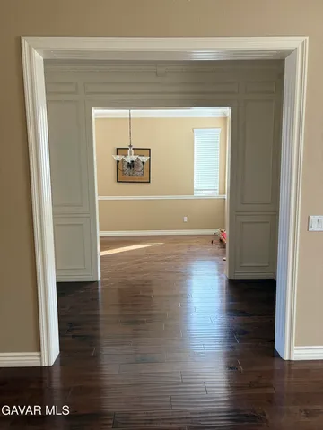 a view of a living room and hardwood floor