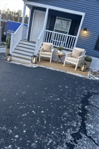 a view of a house with backyard and deck