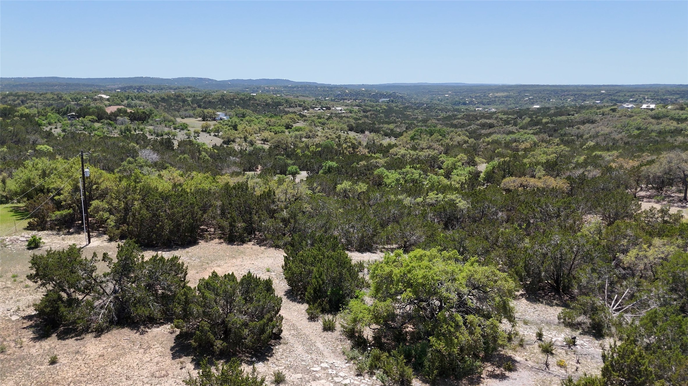 8201 West Fitzhugh Road Dripping Springs, TX 78620 - Photo 5 of 9 a view of a forest with a mountain