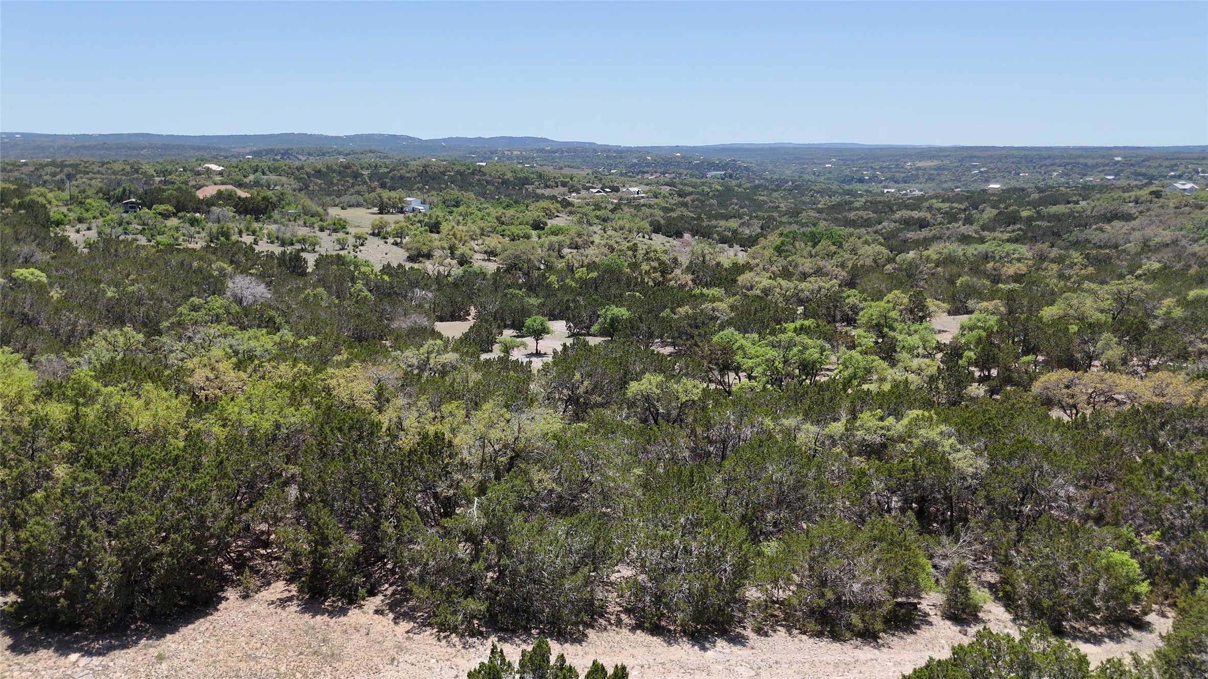 8201 West Fitzhugh Road Dripping Springs, TX 78620 - Photo 6 of 9 a view of a city with lush green forest