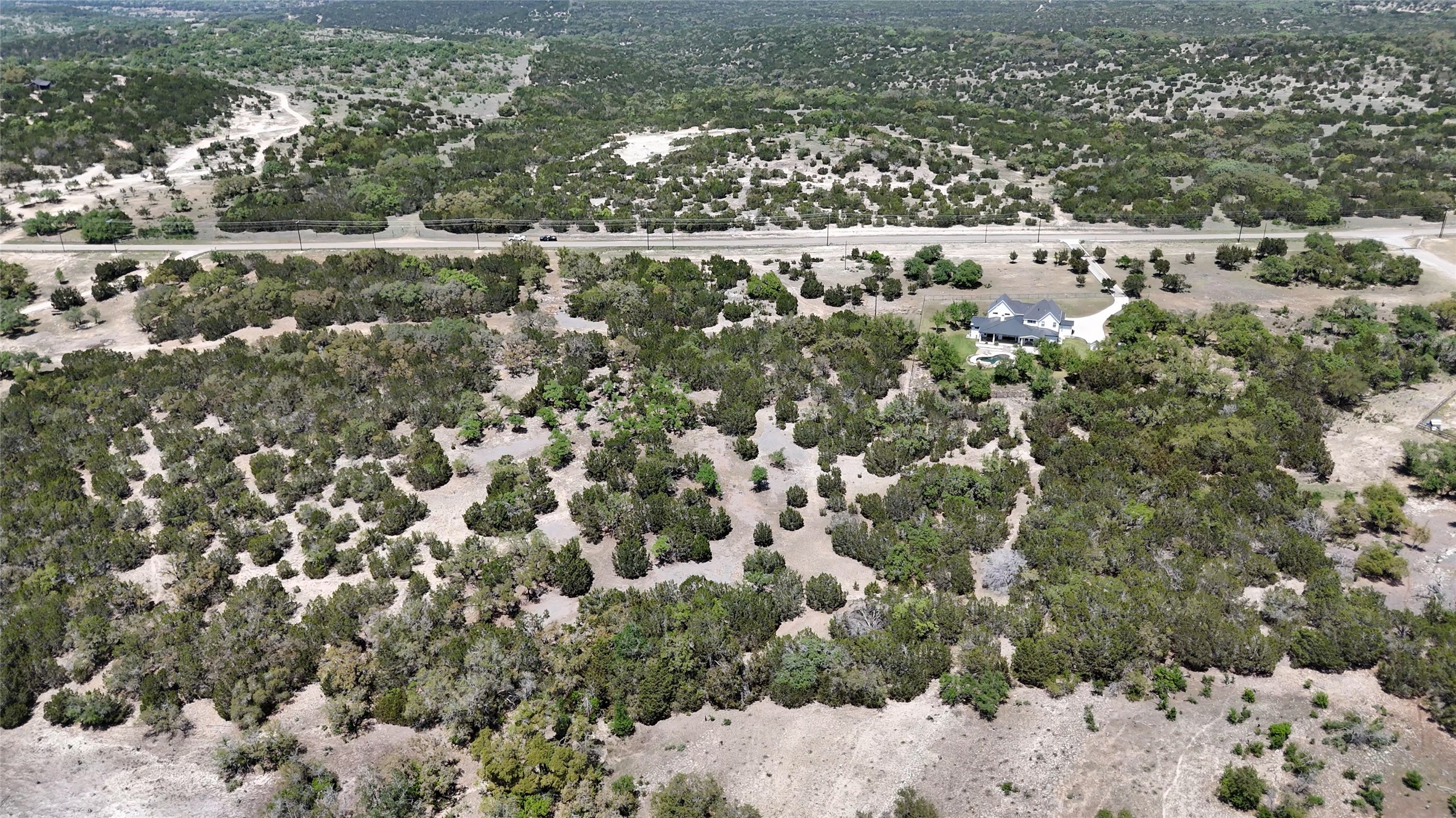 8201 West Fitzhugh Road Dripping Springs, TX 78620 - Photo 8 of 9 a view of a forest with a tree