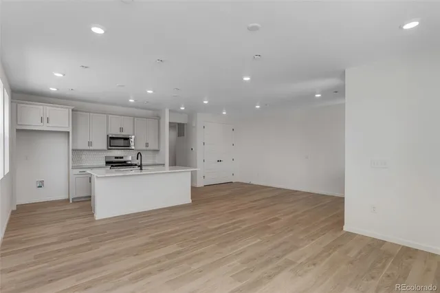 a view of kitchen with wooden floor