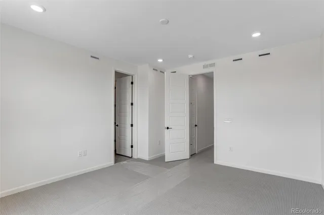 a bathroom with a shower sink and mirror