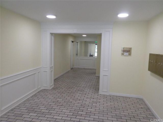 a view of a hallway with closet