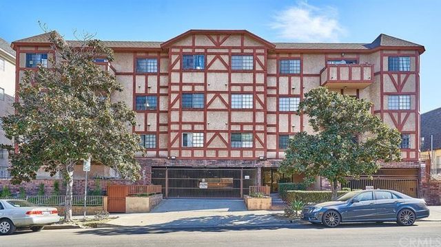 a view of a car parked in front of a building