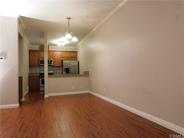 a view of a kitchen with a sink and dishwasher