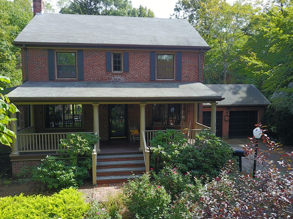 85 Forbes Road Milton, MA 02186 - Photo 1 of 30 a front view of a house with garden