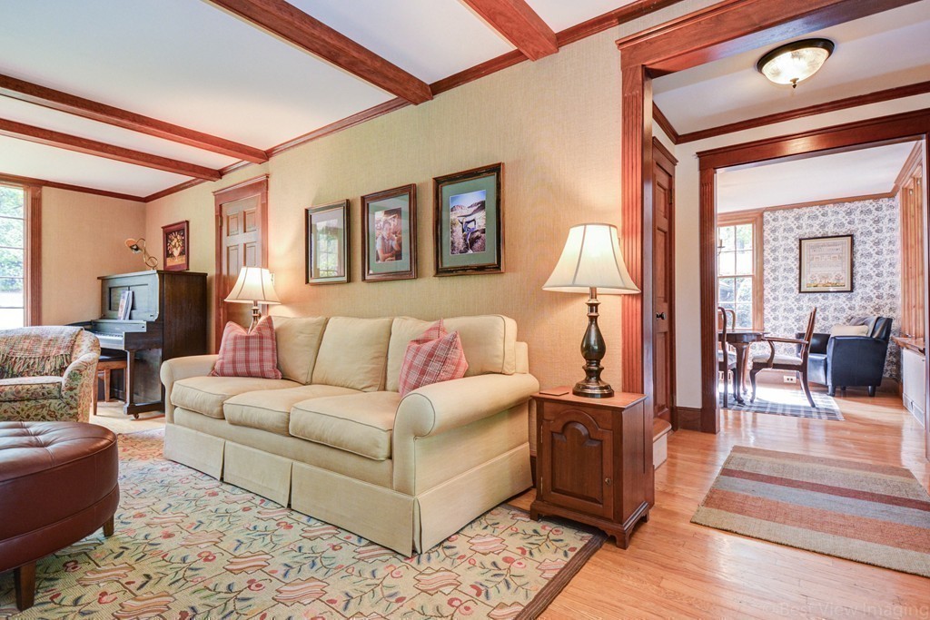 85 Forbes Road Milton, MA 02186 - Photo 11 of 30 a living room with furniture and a lamp