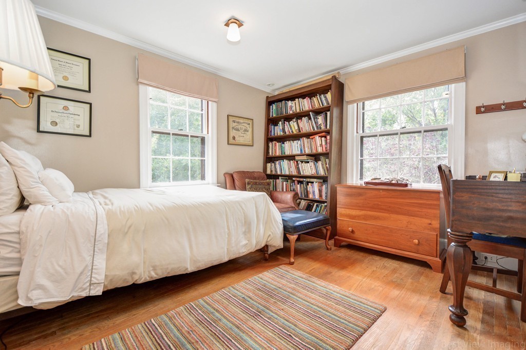 85 Forbes Road Milton, MA 02186 - Photo 18 of 30 a bedroom with a bed and a window