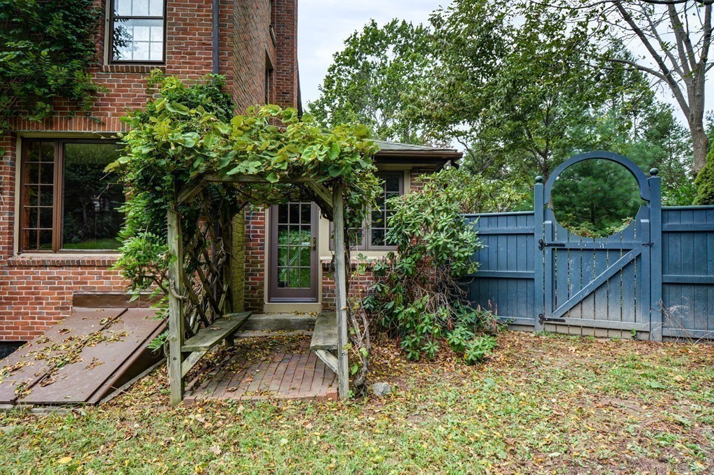 85 Forbes Road Milton, MA 02186 - Photo 26 of 30 a view of a house with a yard and plants