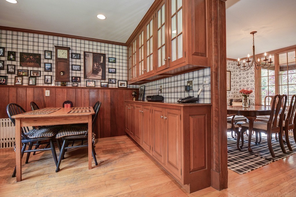 85 Forbes Road Milton, MA 02186 - Photo 6 of 30 a dining room with furniture and a floor to ceiling window