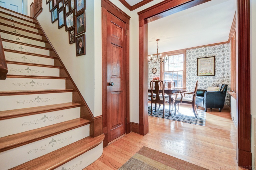 85 Forbes Road Milton, MA 02186 - Photo 8 of 30 a view of entryway and hall with wooden floor