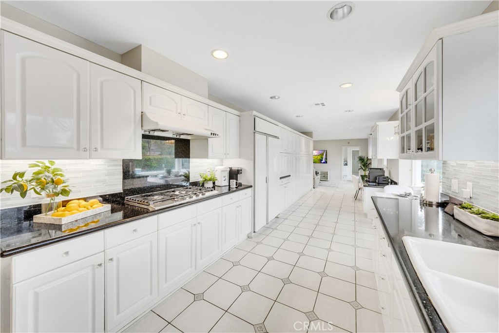 2835 Devonport Road San Marino, CA 91108 - Photo 16 of 54 a kitchen with stainless steel appliances a stove a sink and cabinets