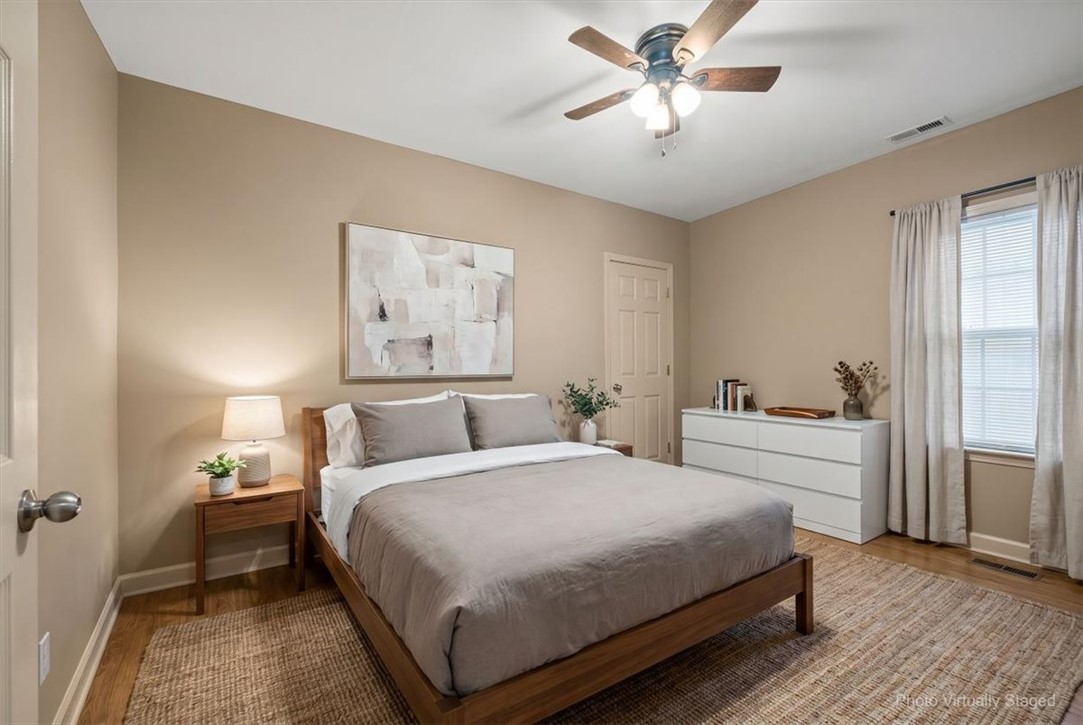 1102 West End Avenue Anderson, SC 29625 - Photo 18 of 28 An inviting sleeping space with warm tones and natural light offers a tranquil retreat.