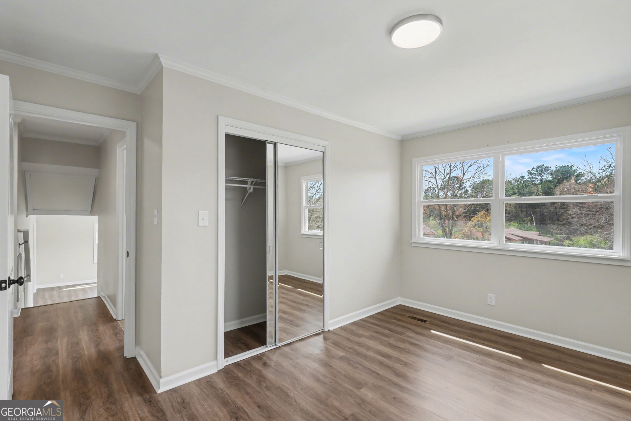 140 Kim Loop Road Demorest, GA 30535 - Photo 16 of 29 wooden floor in an empty room with a window