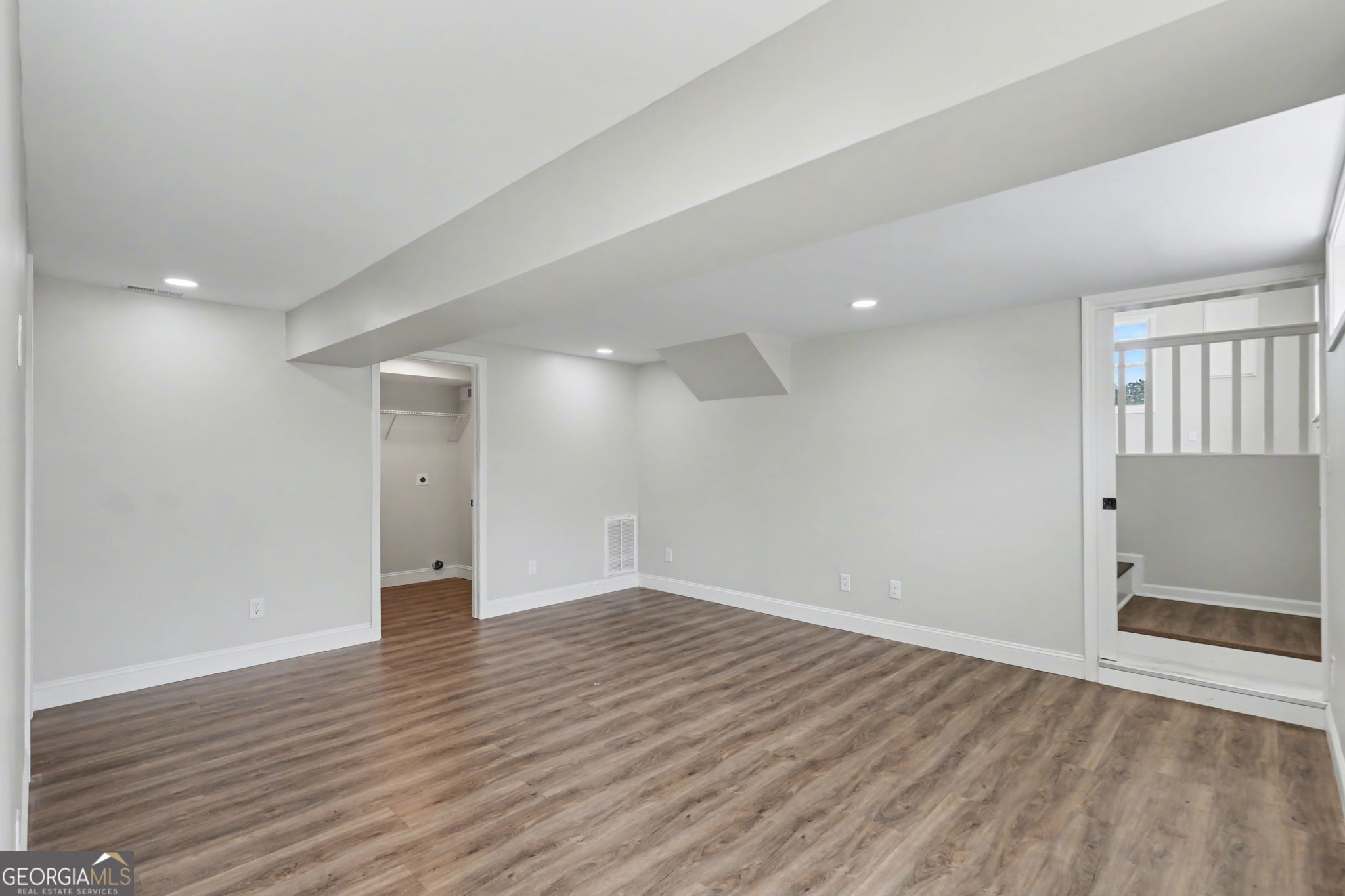 140 Kim Loop Road Demorest, GA 30535 - Photo 20 of 29 wooden floor in an empty room with a window