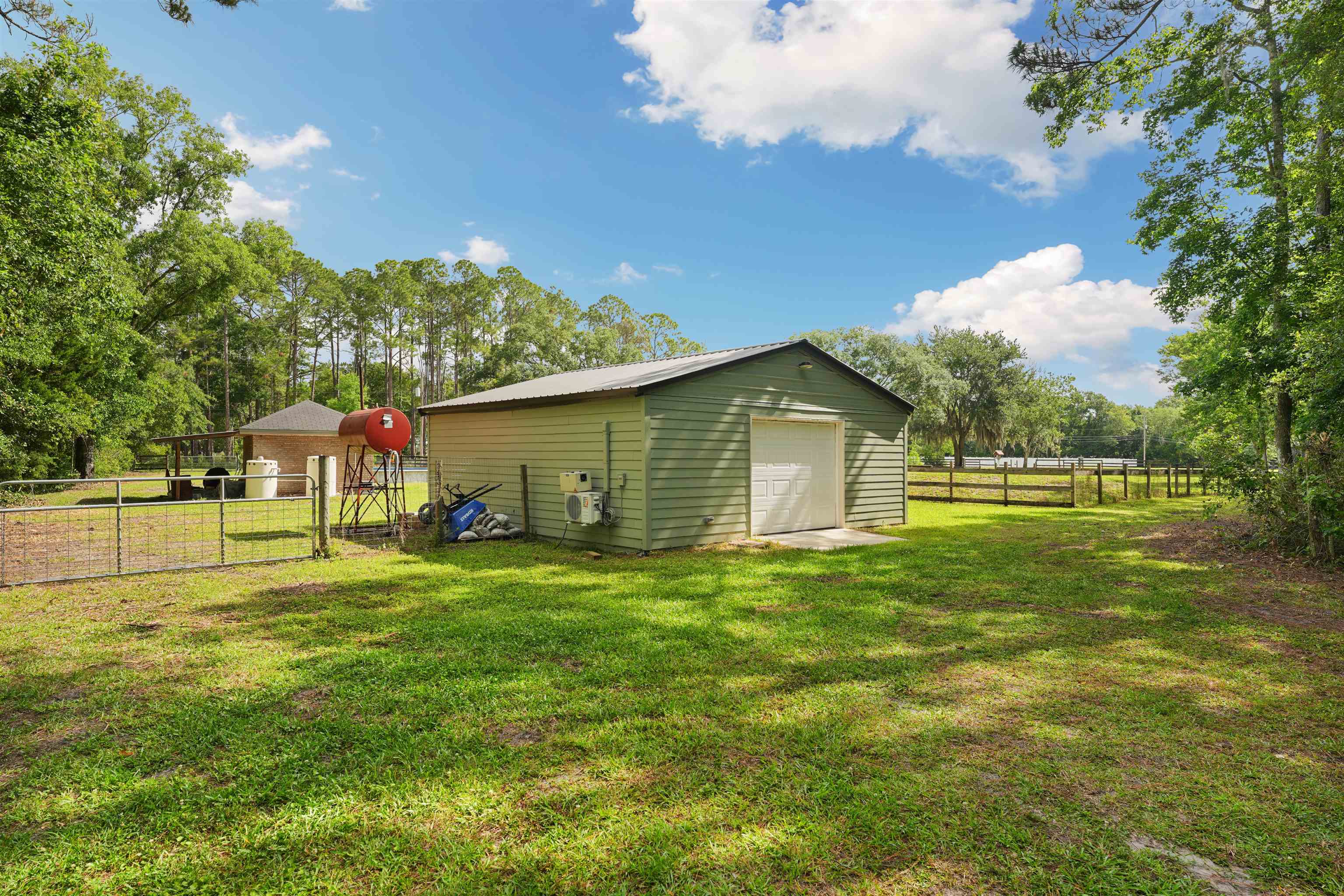 1805 Bennett Road St. Augustine, FL 32092 - Photo 48 of 65 a backyard of a house with table and chairs