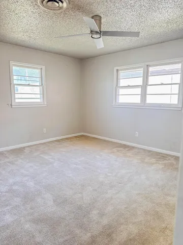 a view of empty room with windows