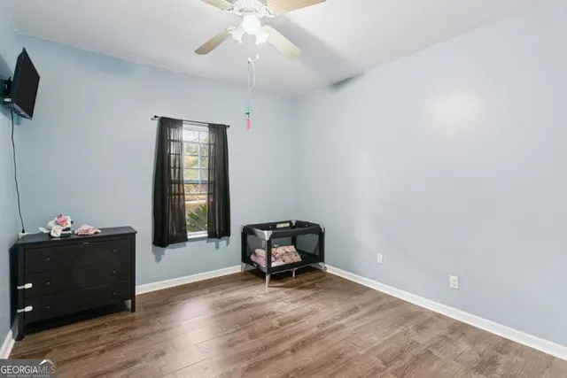 a room with a window and wooden floor