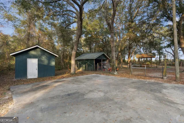 a front view of house with yard and trees