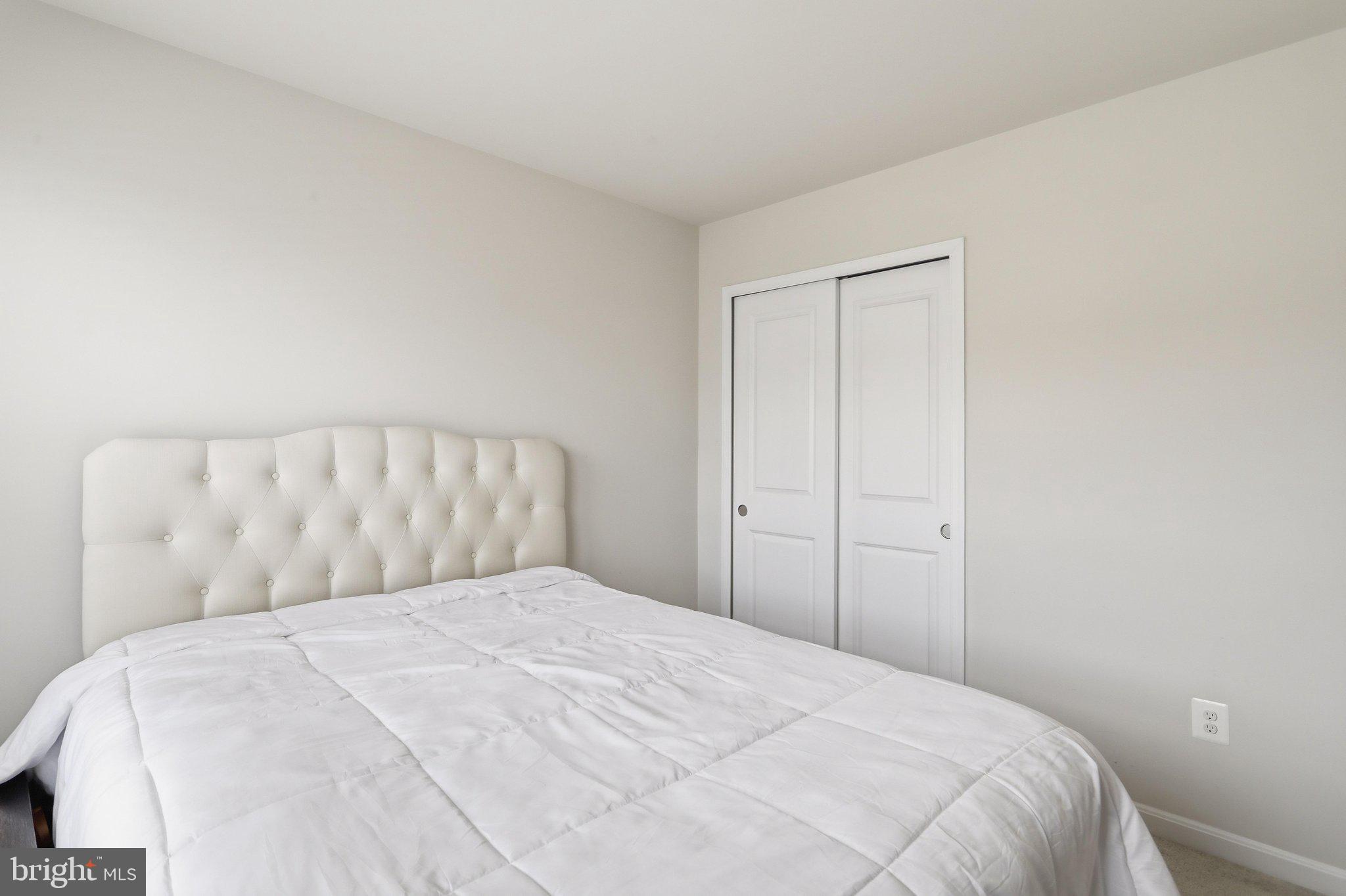 172 Rerdiz Road Hedgesville, WV 25427 - Photo 18 of 36 a bedroom with a bed and a mirror