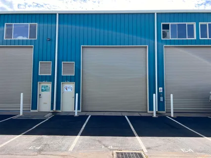 an aerial view of a house with parking space