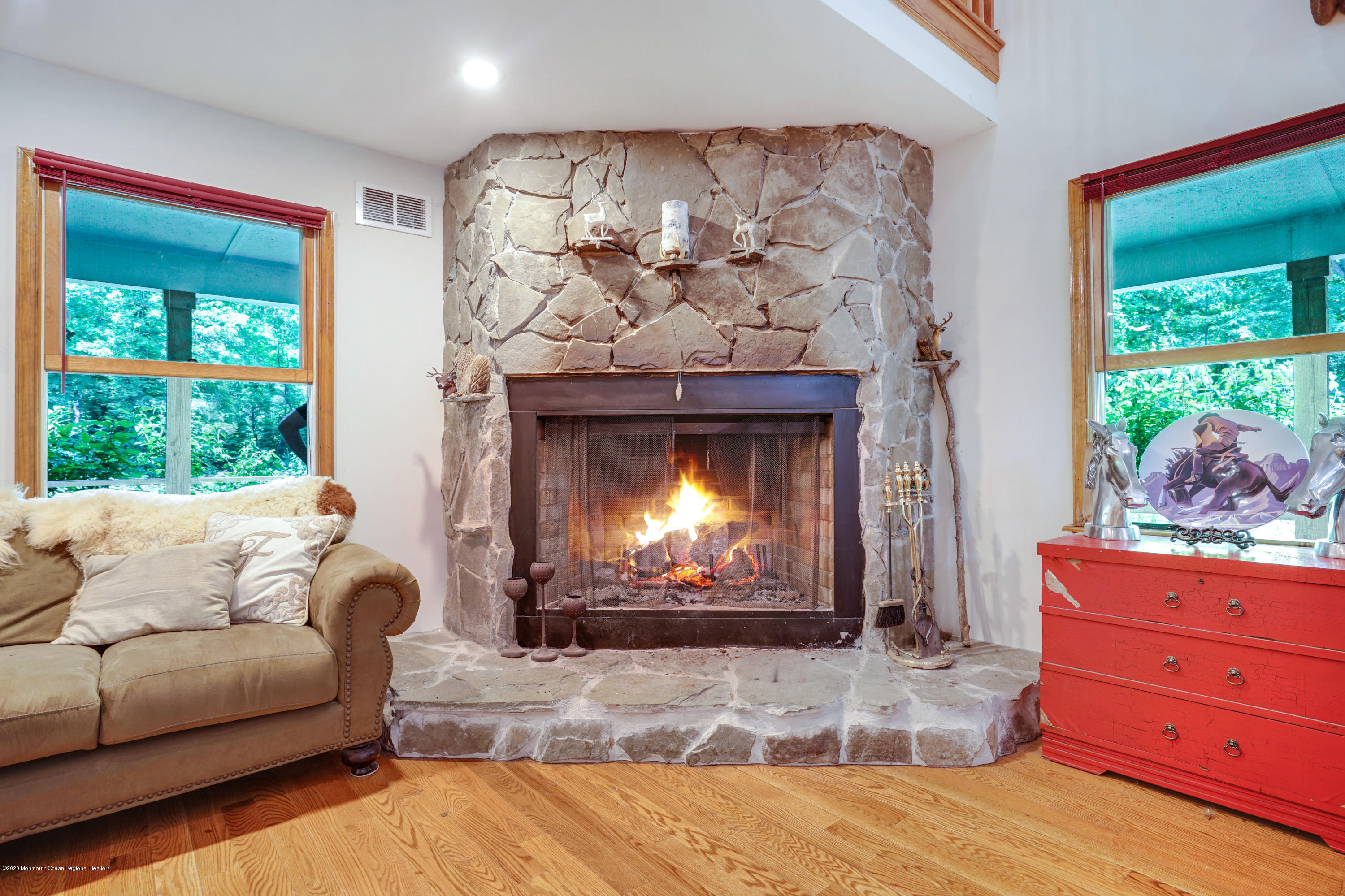 60 Oak Glen Road Howell, NJ 07731 - Photo 11 of 74 a living room with furniture and a fireplace