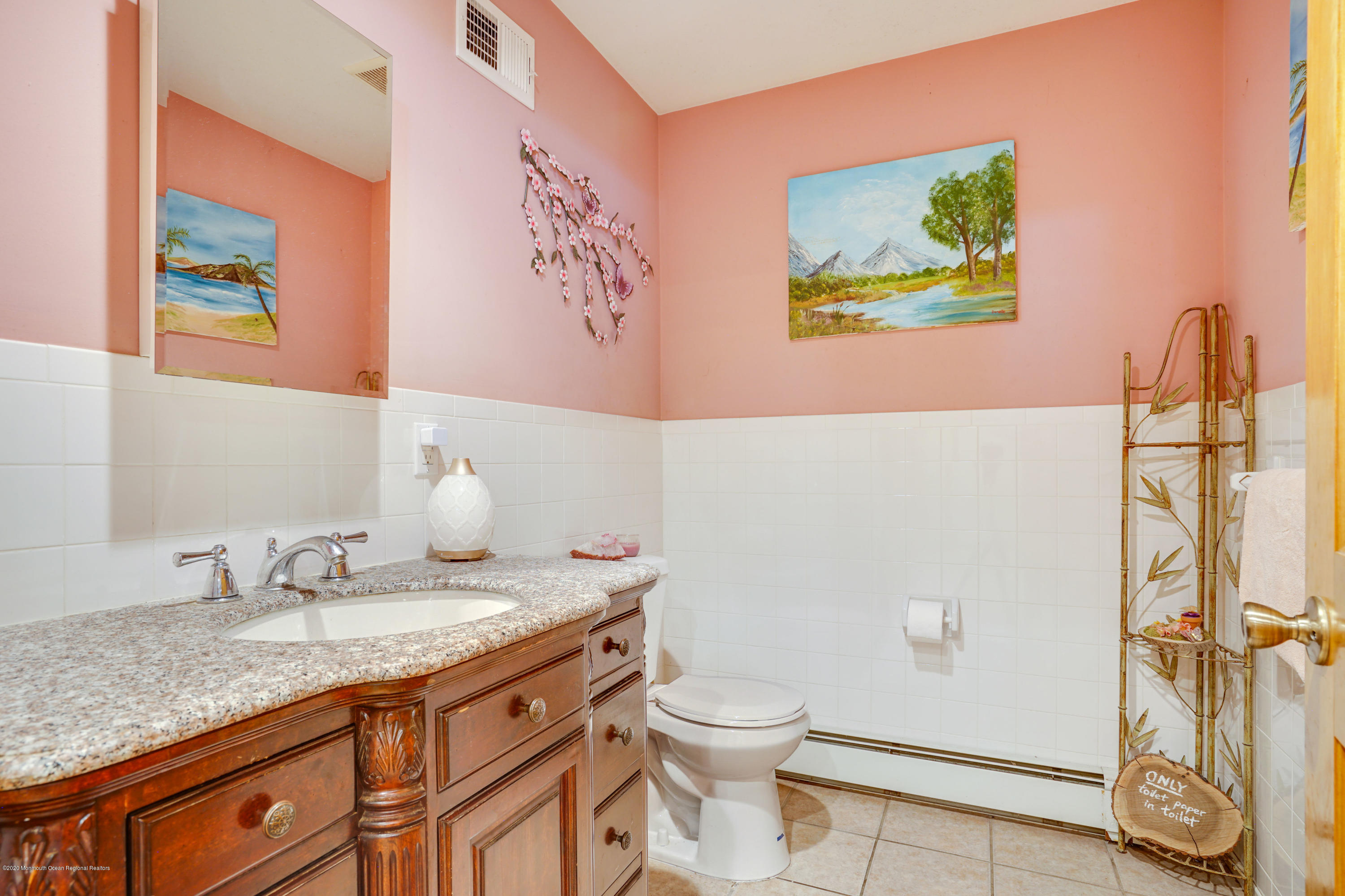 60 Oak Glen Road Howell, NJ 07731 - Photo 20 of 74 a bathroom with a granite countertop toilet a sink and a mirror