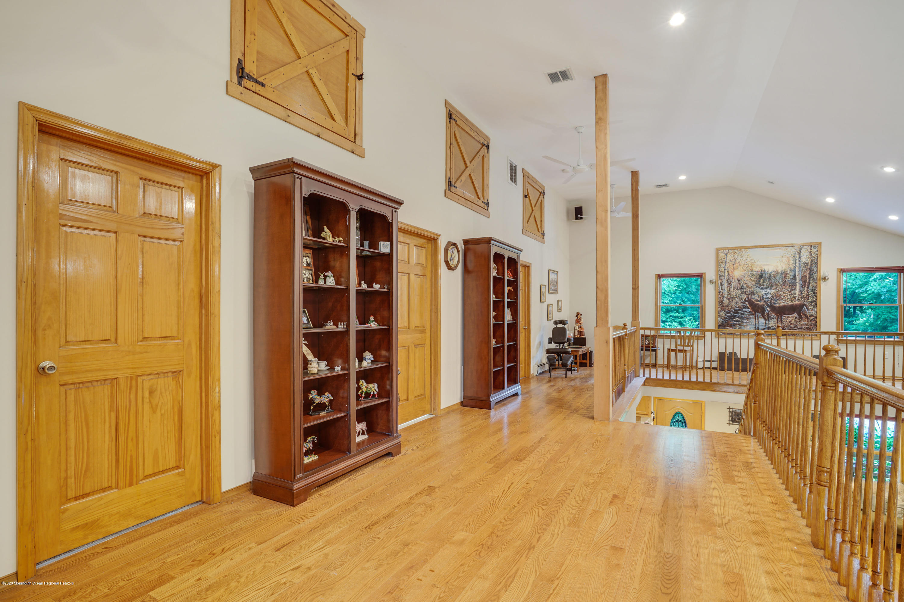 60 Oak Glen Road Howell, NJ 07731 - Photo 22 of 74 a view of a living room filled with furniture and a chandelier