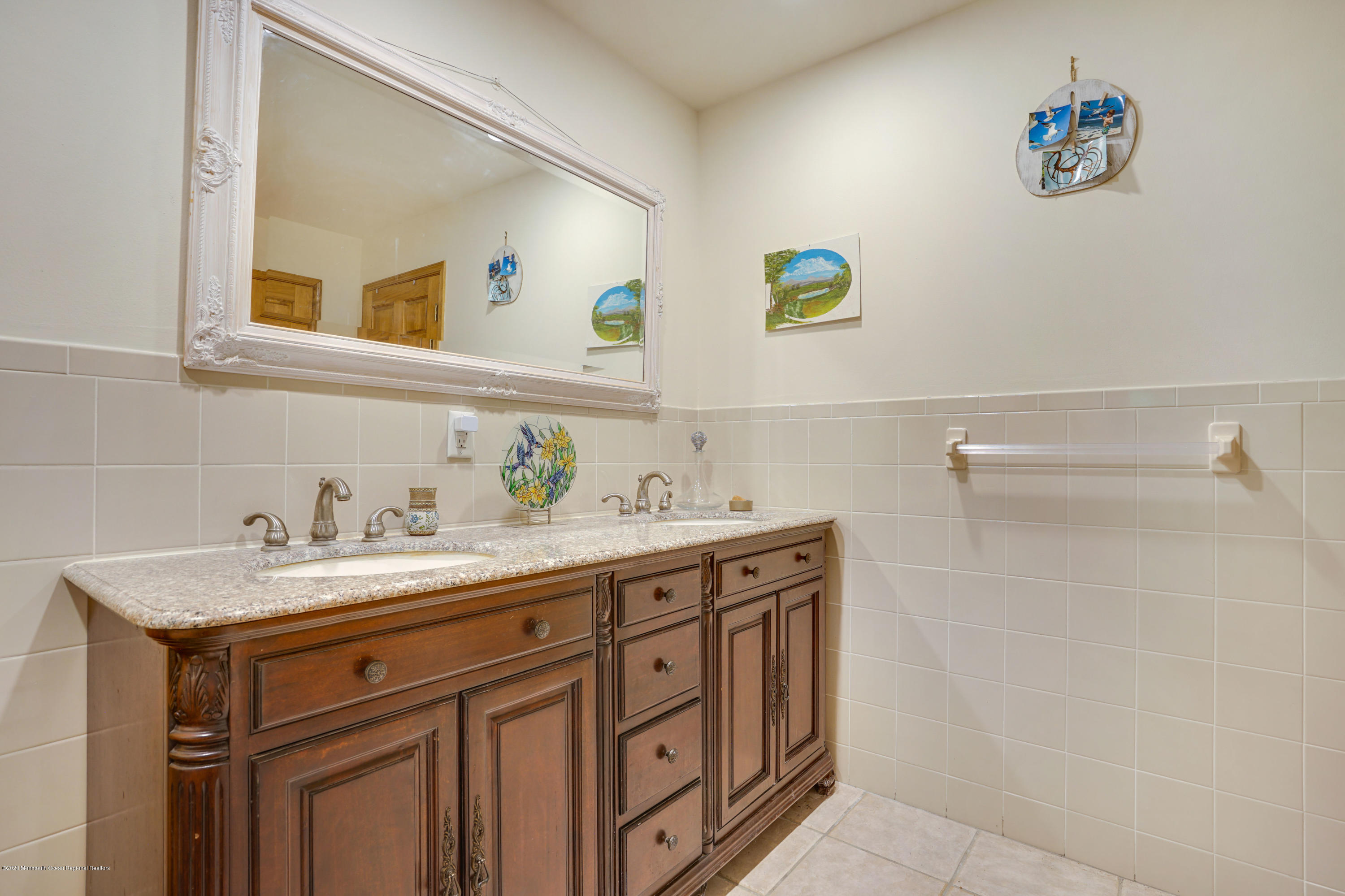 60 Oak Glen Road Howell, NJ 07731 - Photo 28 of 74 a bathroom with a sink a vanity and a mirror
