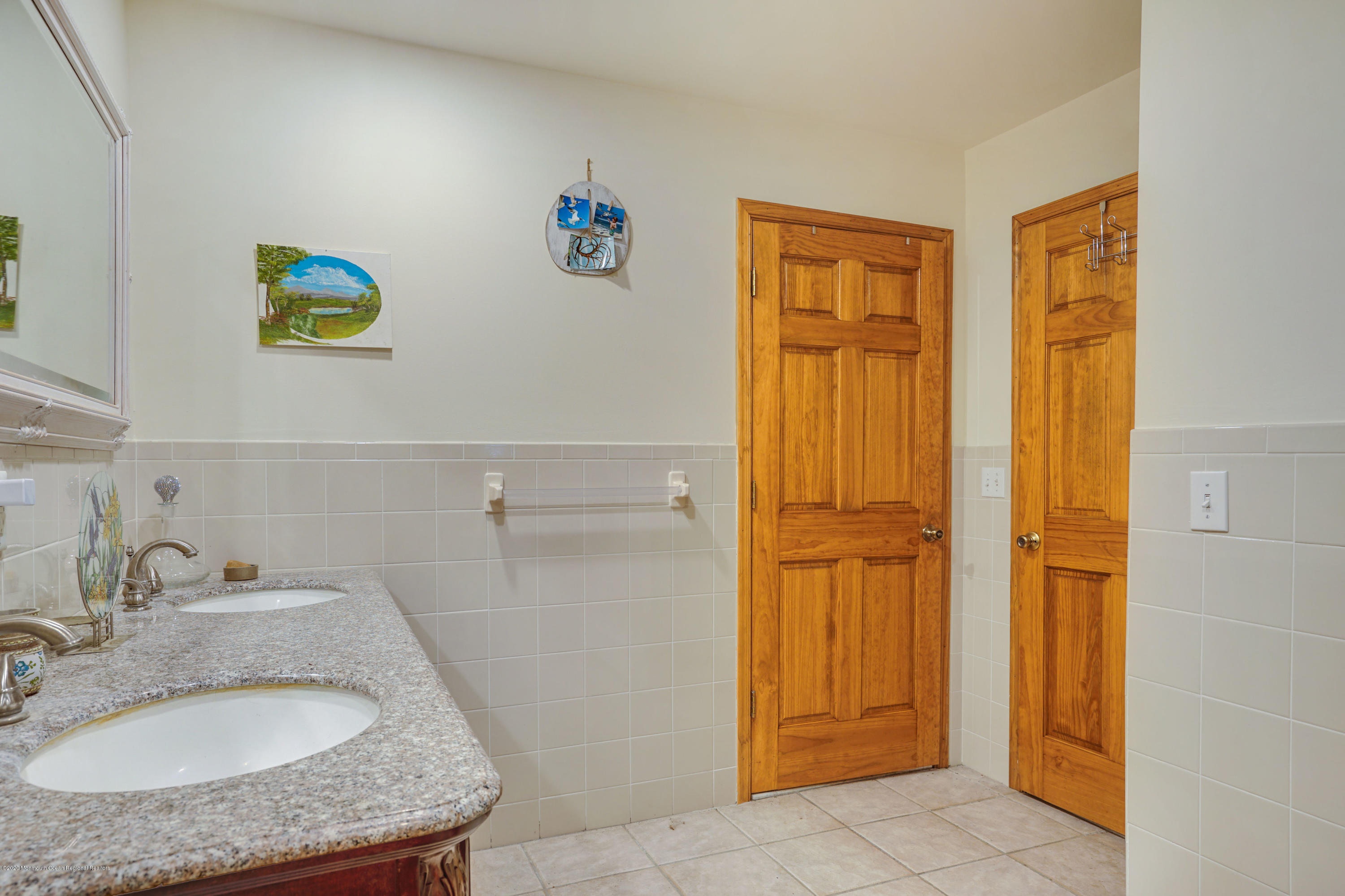 60 Oak Glen Road Howell, NJ 07731 - Photo 29 of 74 a bathroom with a granite countertop sink and a mirror
