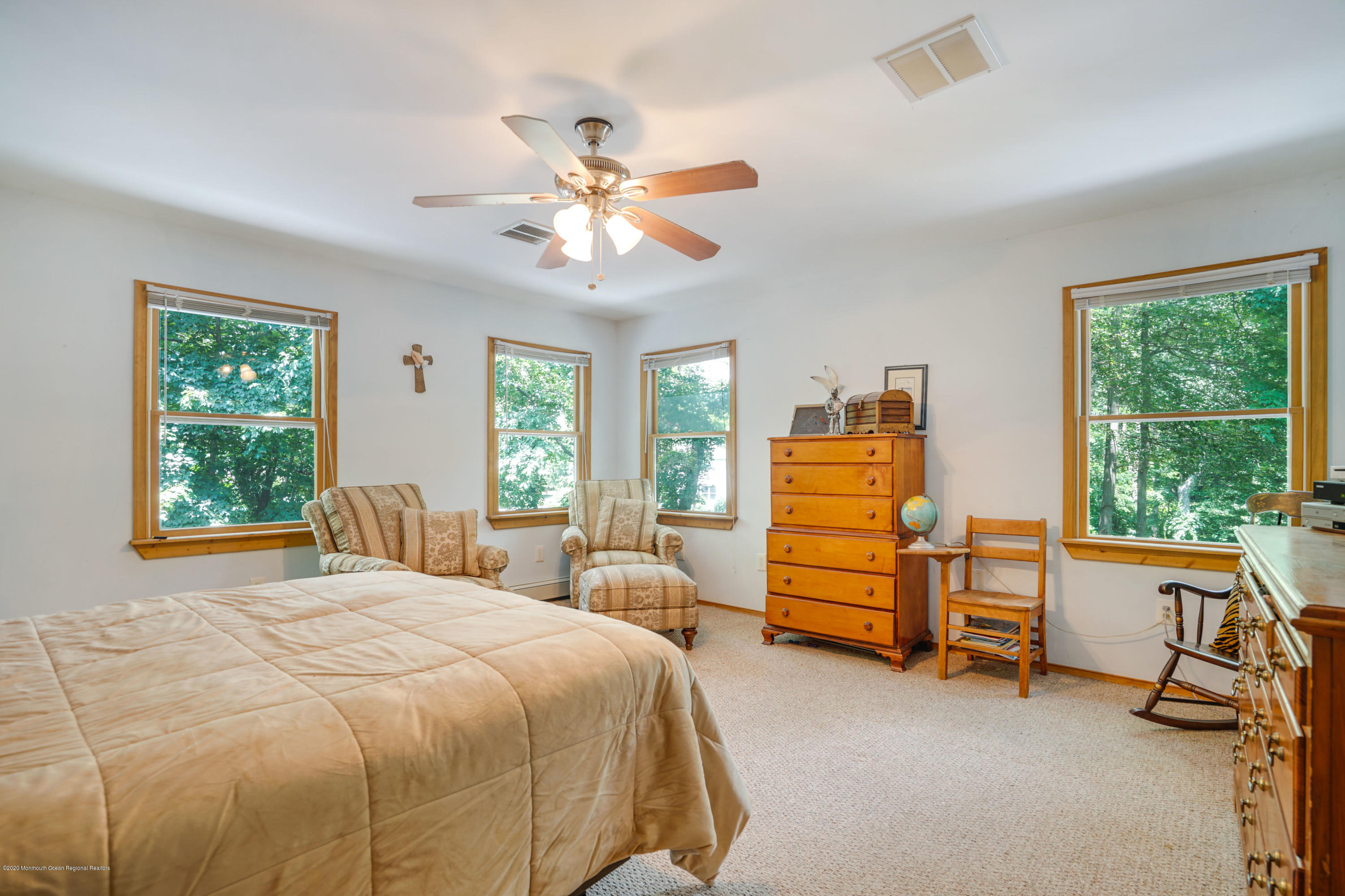 60 Oak Glen Road Howell, NJ 07731 - Photo 30 of 74 a bedroom with a bed and a chandelier