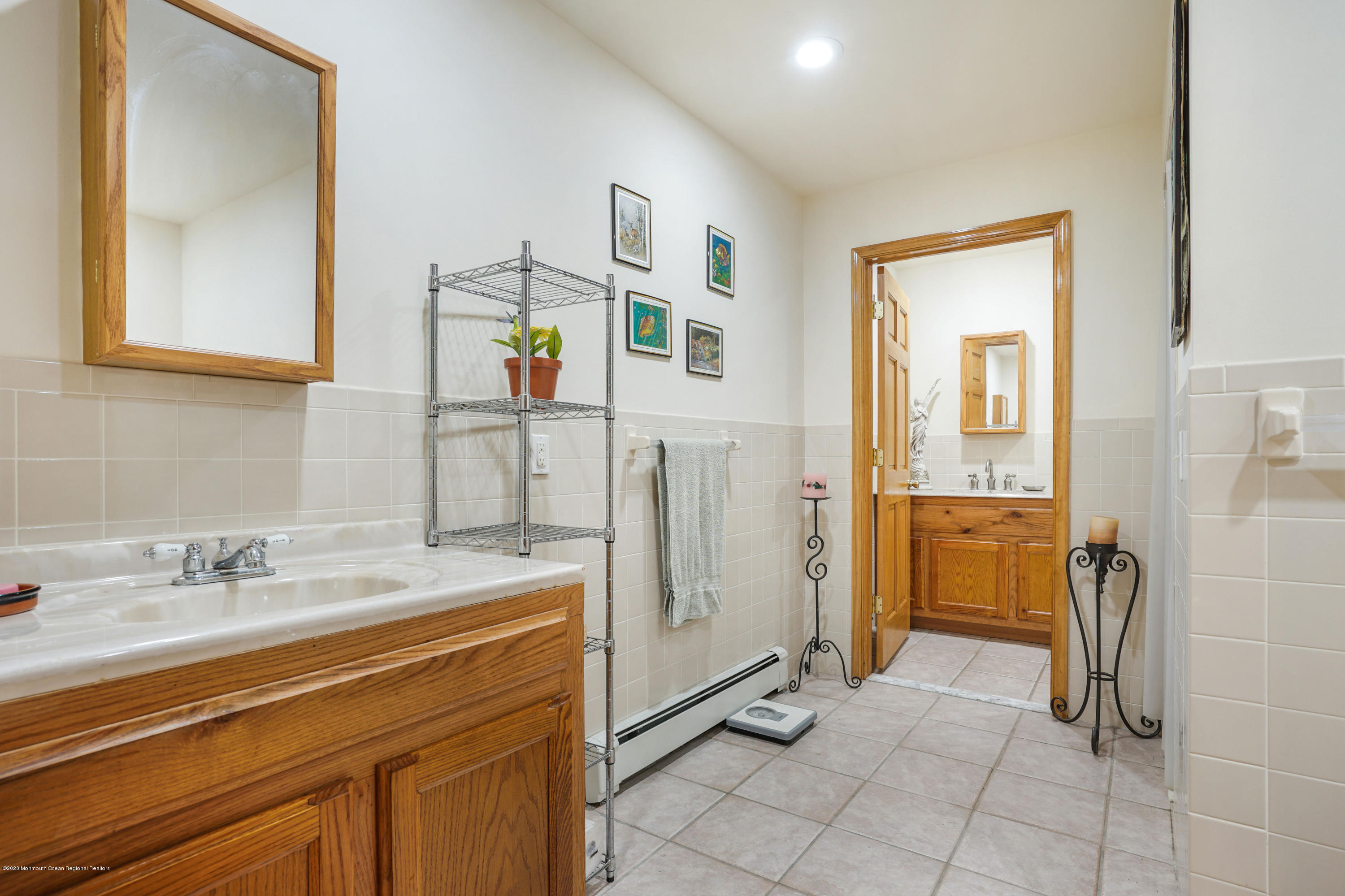 60 Oak Glen Road Howell, NJ 07731 - Photo 32 of 74 a spacious bathroom with a sink a mirror and a shower