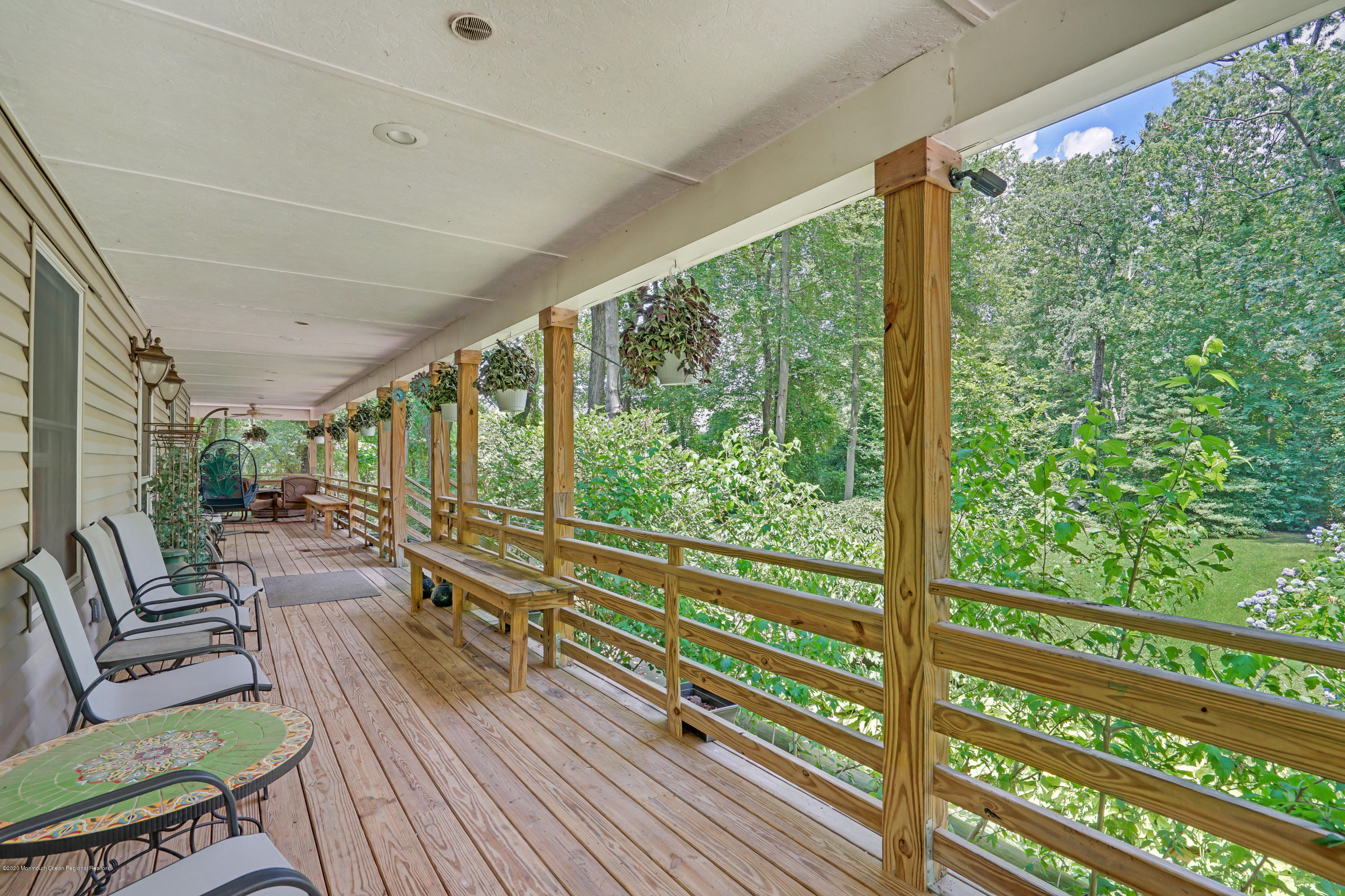 60 Oak Glen Road Howell, NJ 07731 - Photo 49 of 74 a view of a porch with furniture and wooden floor