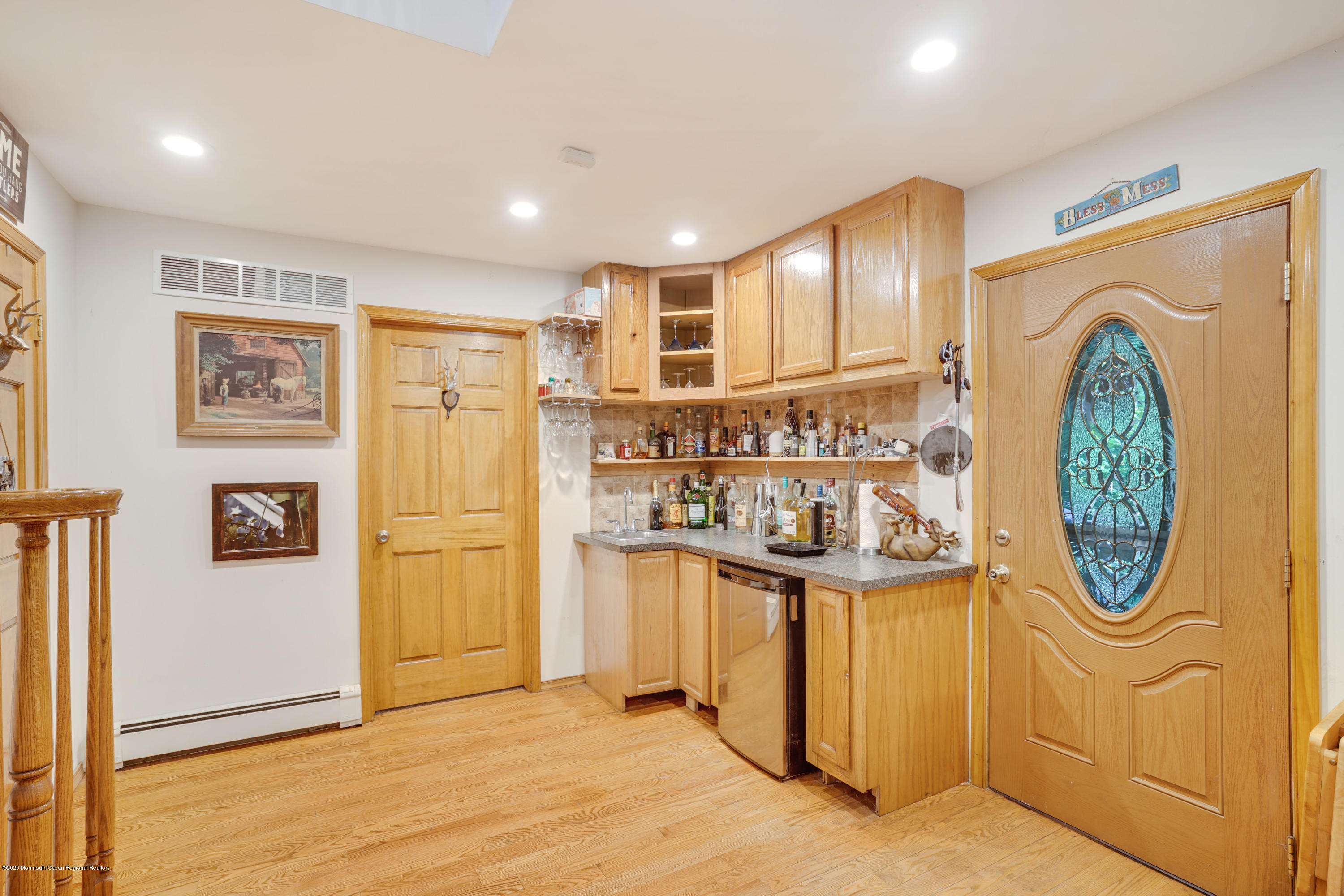 60 Oak Glen Road Howell, NJ 07731 - Photo 6 of 74 a view of a hallway with stainless steel appliances granite countertop cabinets and a window
