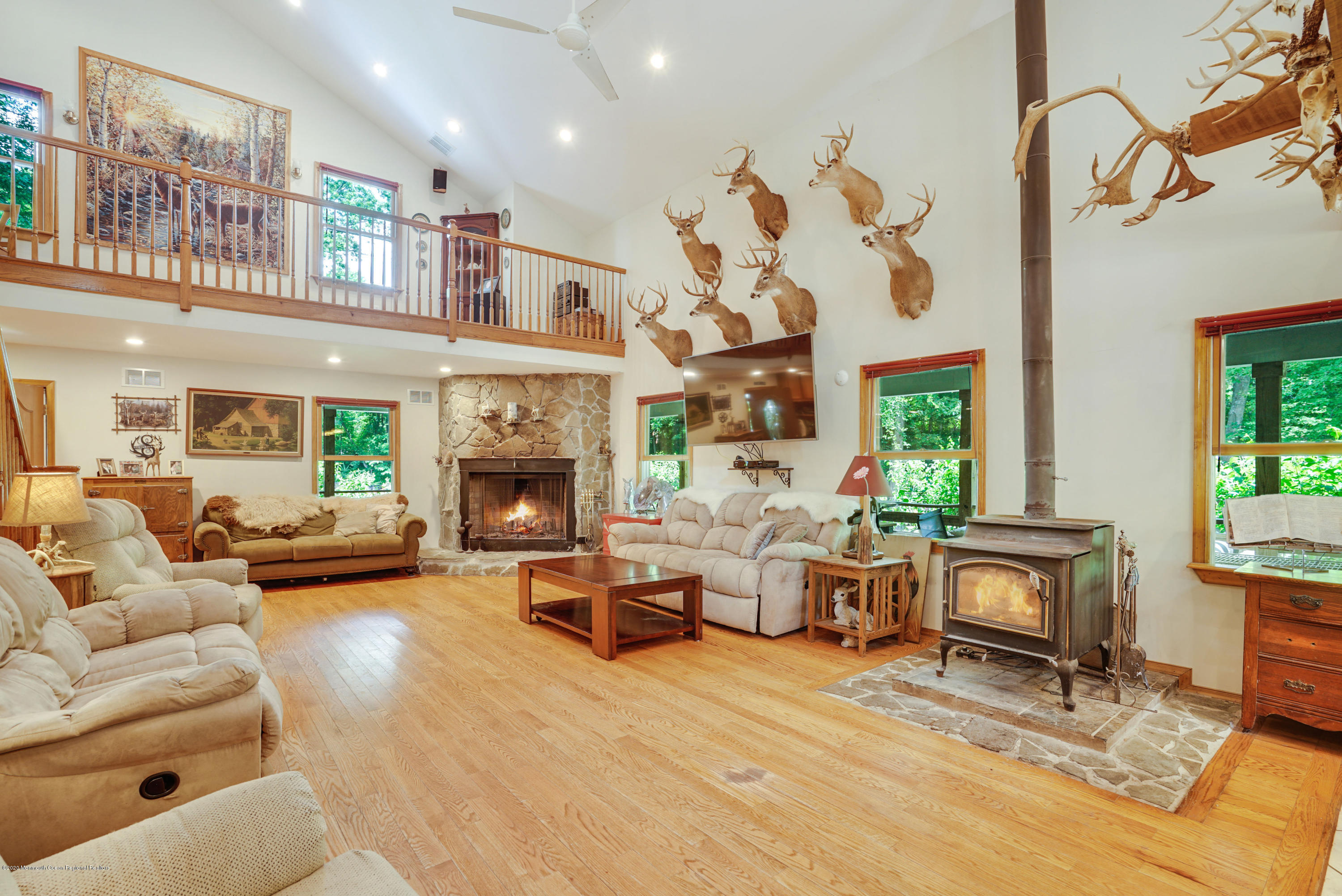 60 Oak Glen Road Howell, NJ 07731 - Photo 10 of 74 a living room with furniture large window and fireplace