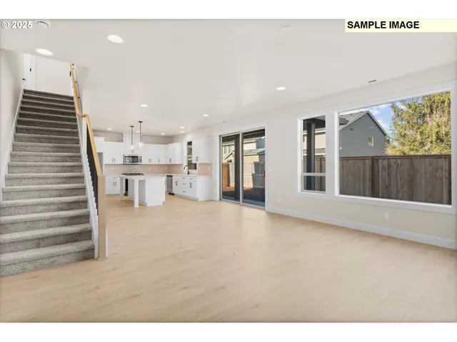 a view of an empty room with a fireplace