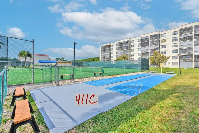 a view of a basketball court with a big room