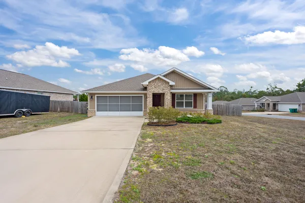 a front view of a house with yard
