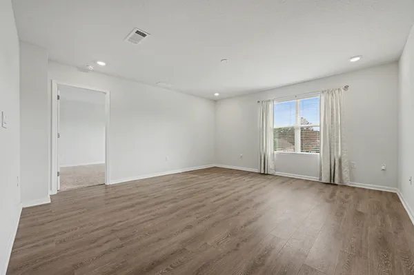 a view of an empty room with a window