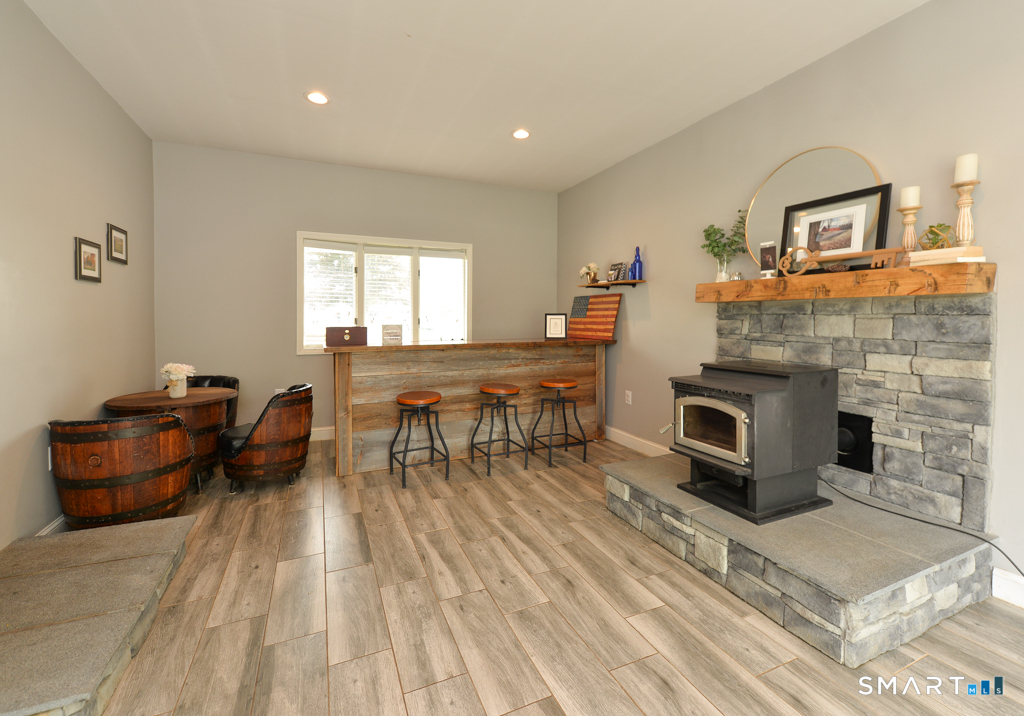 109 Harrison Lane Bethlehem, CT 06751 - Photo 12 of 28 a living room with furniture and a fireplace