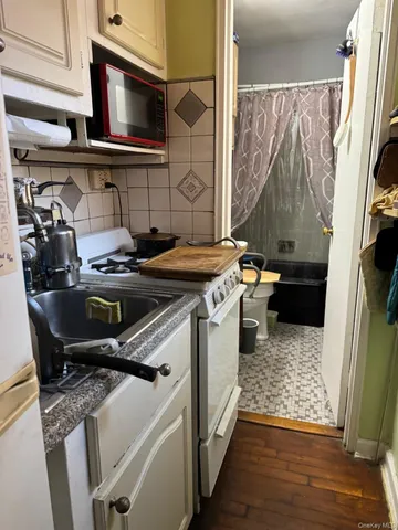a kitchen that has a sink and a stove