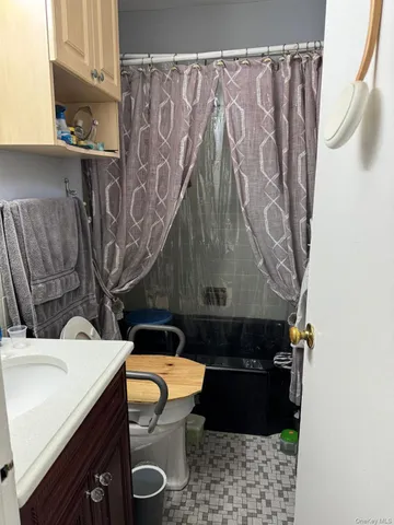 a bathroom with a sink and toilet