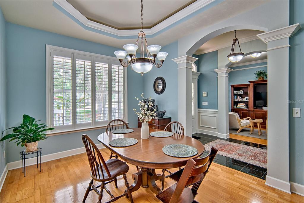 10912 Southwest 17 Lane Gainesville, FL 32607 - Photo 16 of 67 a view of a dining room with furniture window and wooden floor