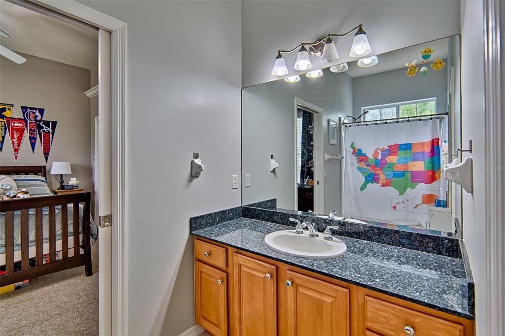 10912 Southwest 17 Lane Gainesville, FL 32607 - Photo 30 of 67 a bathroom with a sink double vanity and a mirror