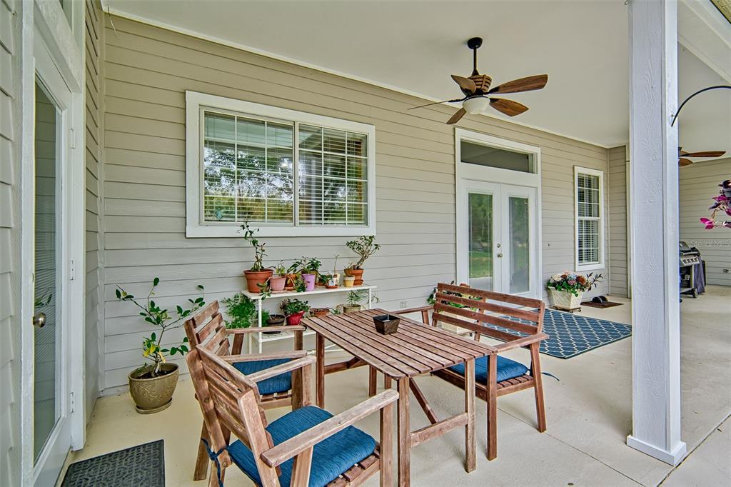 10912 Southwest 17 Lane Gainesville, FL 32607 - Photo 36 of 67 a table and chairs in front of a house