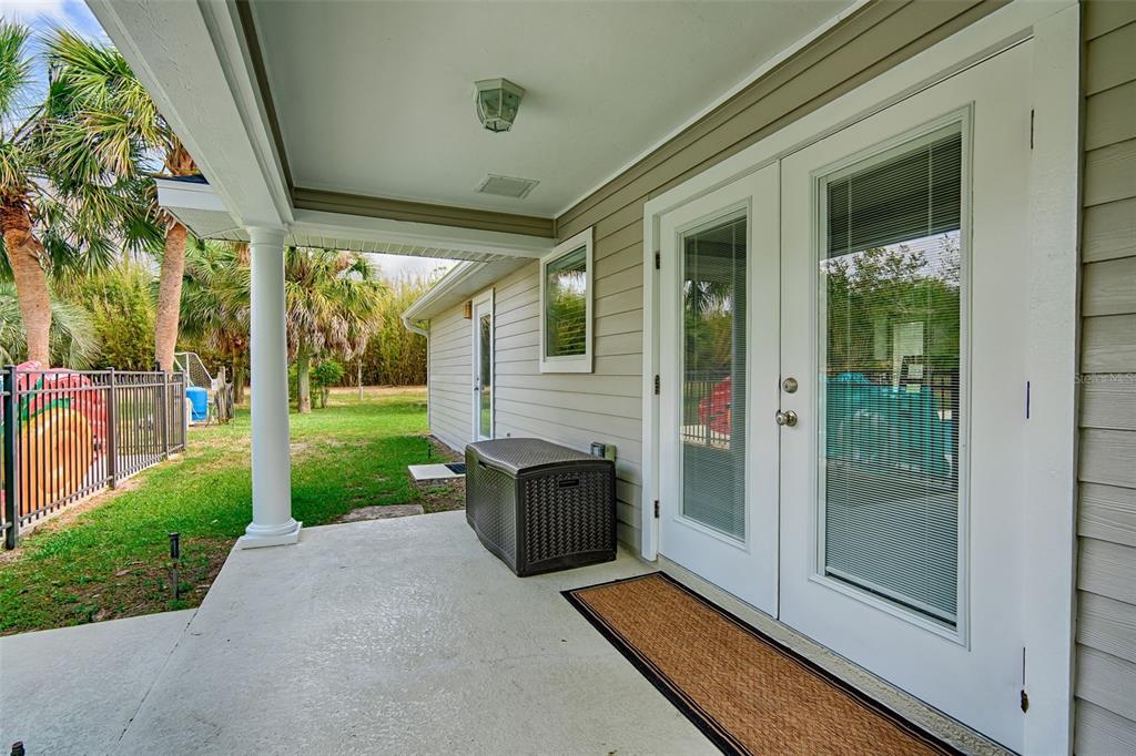 10912 Southwest 17 Lane Gainesville, FL 32607 - Photo 41 of 67 a view of a door and chair in front of house